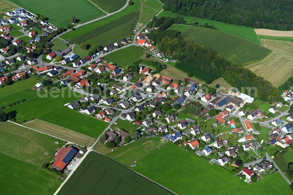 Lauterbrunn from the bird's eye view: Agricultural land and field borders surround the settlement area of the village in Lauterbrunn in the state Bavaria, Germany