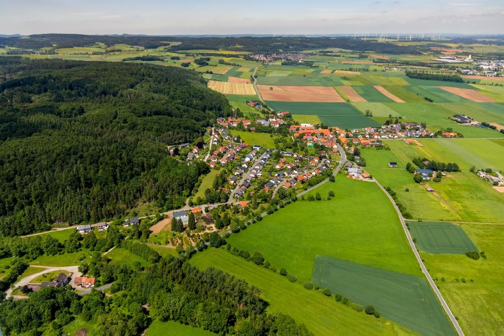 Aerial image Lengefeld - Agricultural land and field borders surround the settlement area of the village in Lengefeld in the state Hesse, Germany