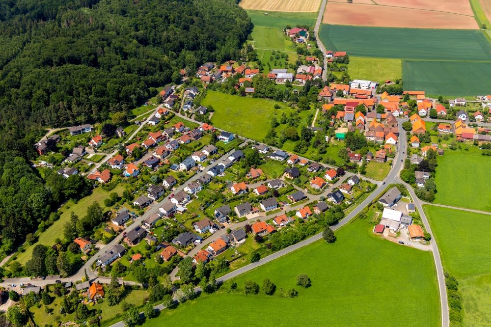 Lengefeld from above - Agricultural land and field borders surround the settlement area of the village in Lengefeld in the state Hesse, Germany