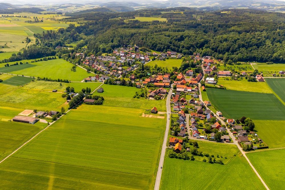 Aerial image Lengefeld - Agricultural land and field borders surround the settlement area of the village in Lengefeld in the state Hesse, Germany