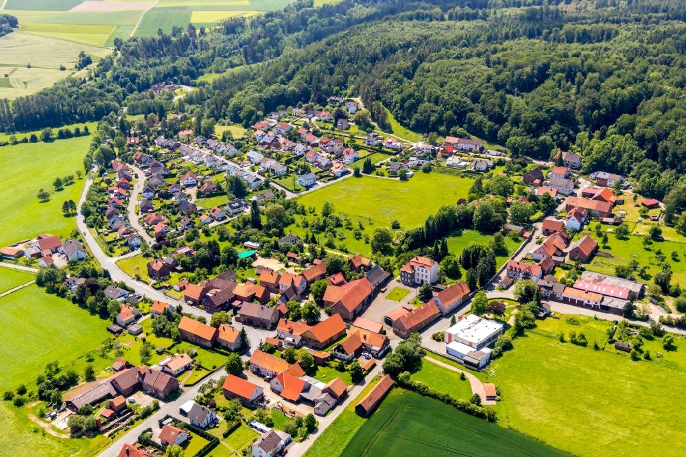 Lengefeld from above - Agricultural land and field borders surround the settlement area of the village in Lengefeld in the state Hesse, Germany