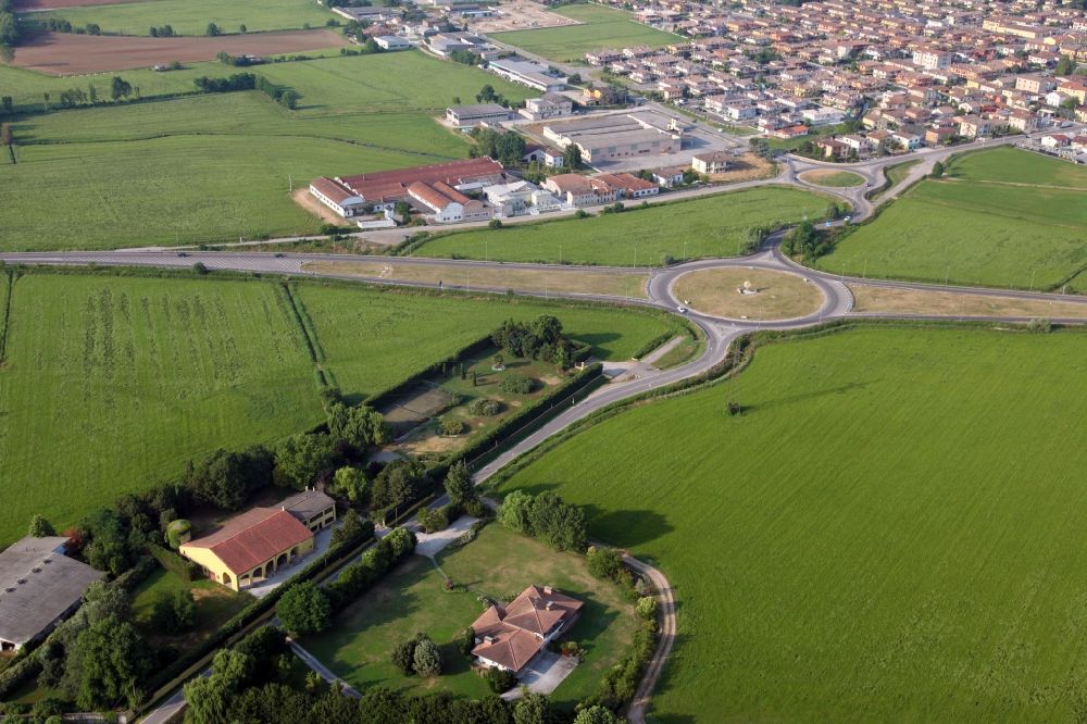 Marmirolo from the bird's eye view: Agricultural land and field borders surround the settlement area of the village in Marmirolo in the Lombardy, Italy