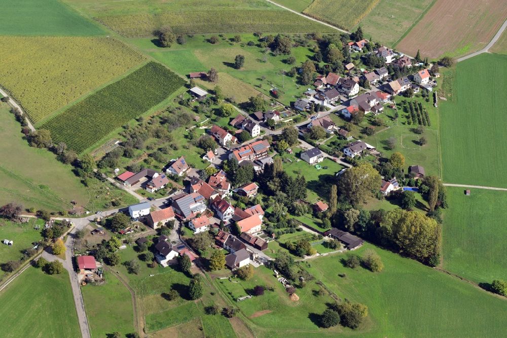 Maugenhard from the bird's eye view: Agricultural land and field borders surround the settlement area of the village in Maugenhard in the state Baden-Wurttemberg, Germany