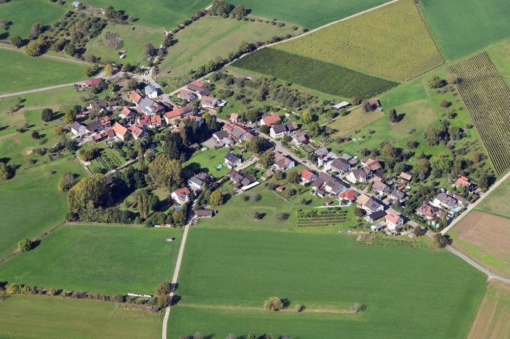 Aerial image Maugenhard - Agricultural land and field borders surround the settlement area of the village in Maugenhard in the state Baden-Wurttemberg, Germany