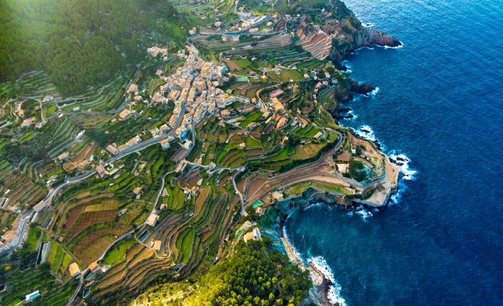 Aerial image Banyalbufar - Village on marine coastal area of Balearic Sea in Banyalbufar in Balearic Islands, Spain