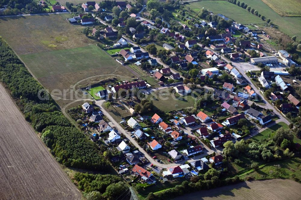 Aerial image Mose - Agricultural land and field borders surround the settlement area of the village in Mose in the state Saxony-Anhalt, Germany