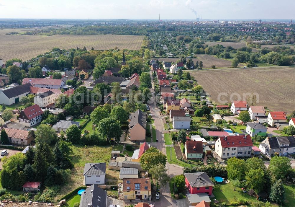 Mötzlich from above - Agricultural land and field borders surround the settlement area of the village in Moetzlich in the state Saxony-Anhalt, Germany