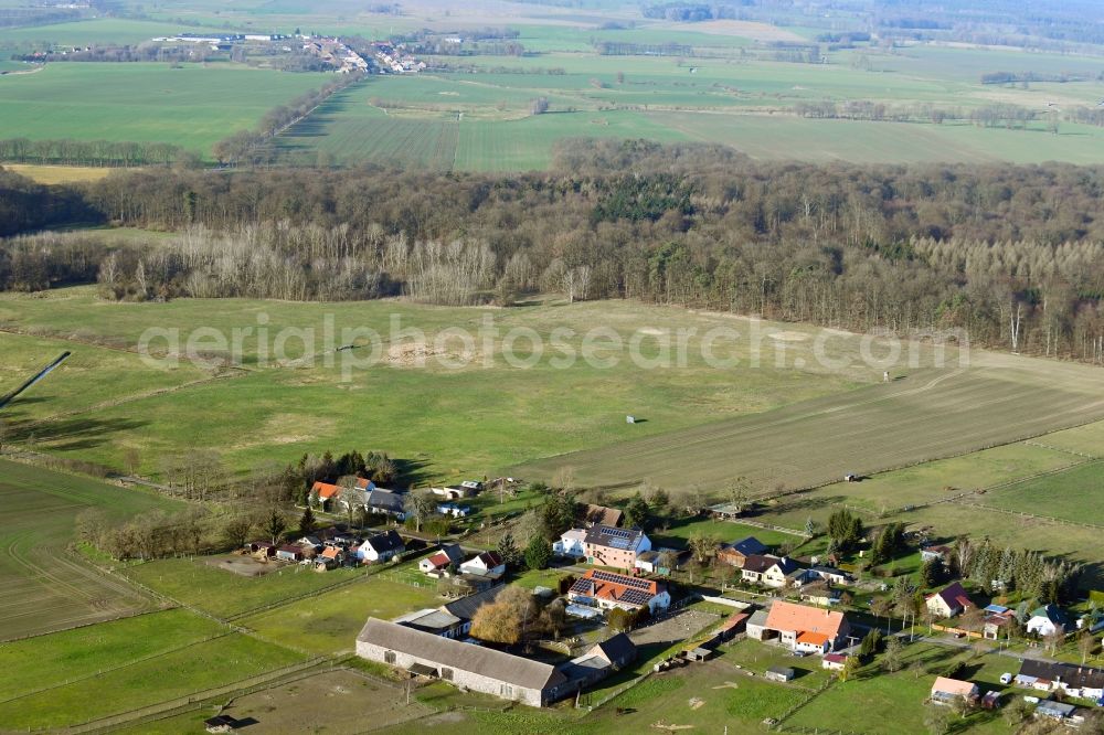 Aerial image Neulüdersdorf - Agricultural land and field borders surround the settlement area of the village in Neuluedersdorf in the state Brandenburg, Germany