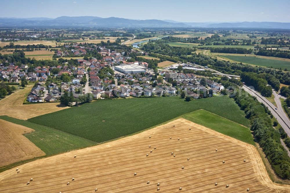 Aerial image Neumühl - Agricultural land and field borders surround the settlement area of the village in Neumuehl in the state Baden-Wurttemberg, Germany