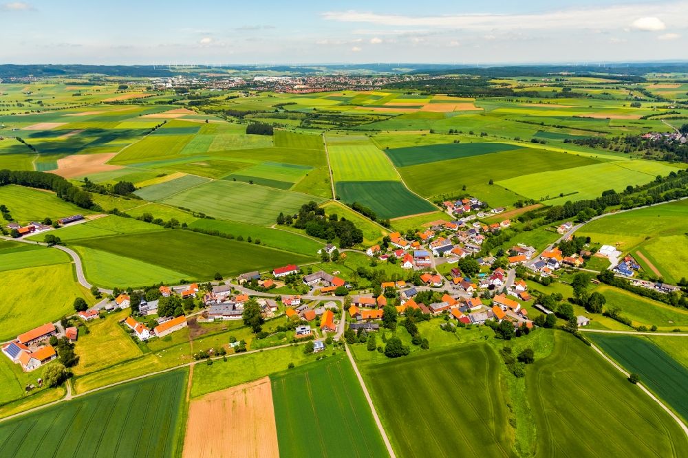 Aerial photograph Nieder-Ense - Agricultural land and field borders surround the settlement area of the village in Nieder-Ense in the state Hesse, Germany