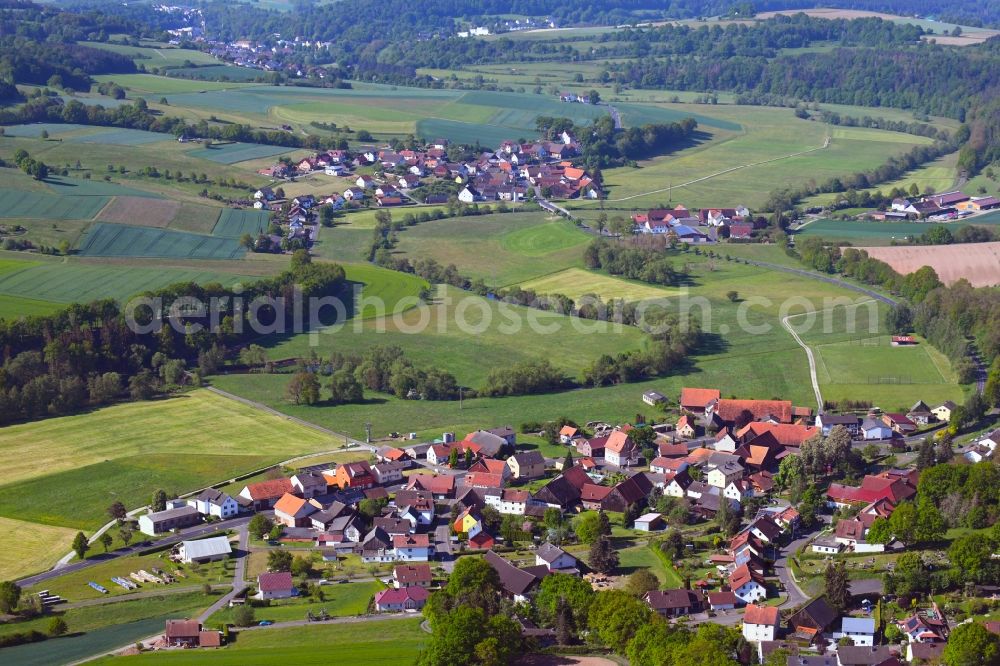 Niederstoll from the bird's eye view: Agricultural land and field borders surround the settlement area of the village in Niederstoll in the state Hesse, Germany
