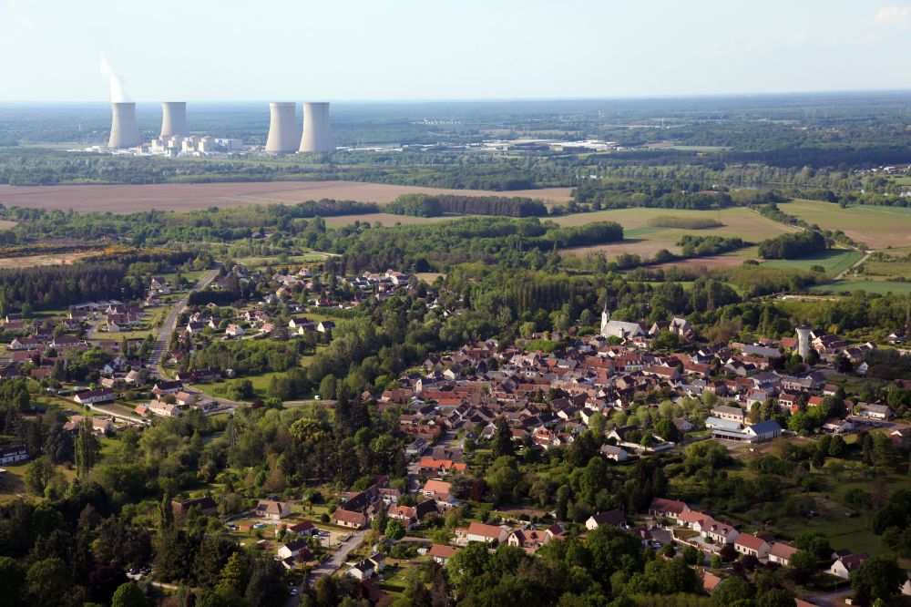 Aerial image Saint-Gondon - Agricultural land and field boundaries with the power plants Centrale nucleaire de Dampierre surround the settlement area of the village in Saint-Gondon in Centre-Val de Loire, France