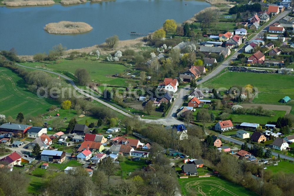 Neukünkendorf from above - Village on the lake bank areas on Haussee in Neukuenkendorf in the state Brandenburg, Germany