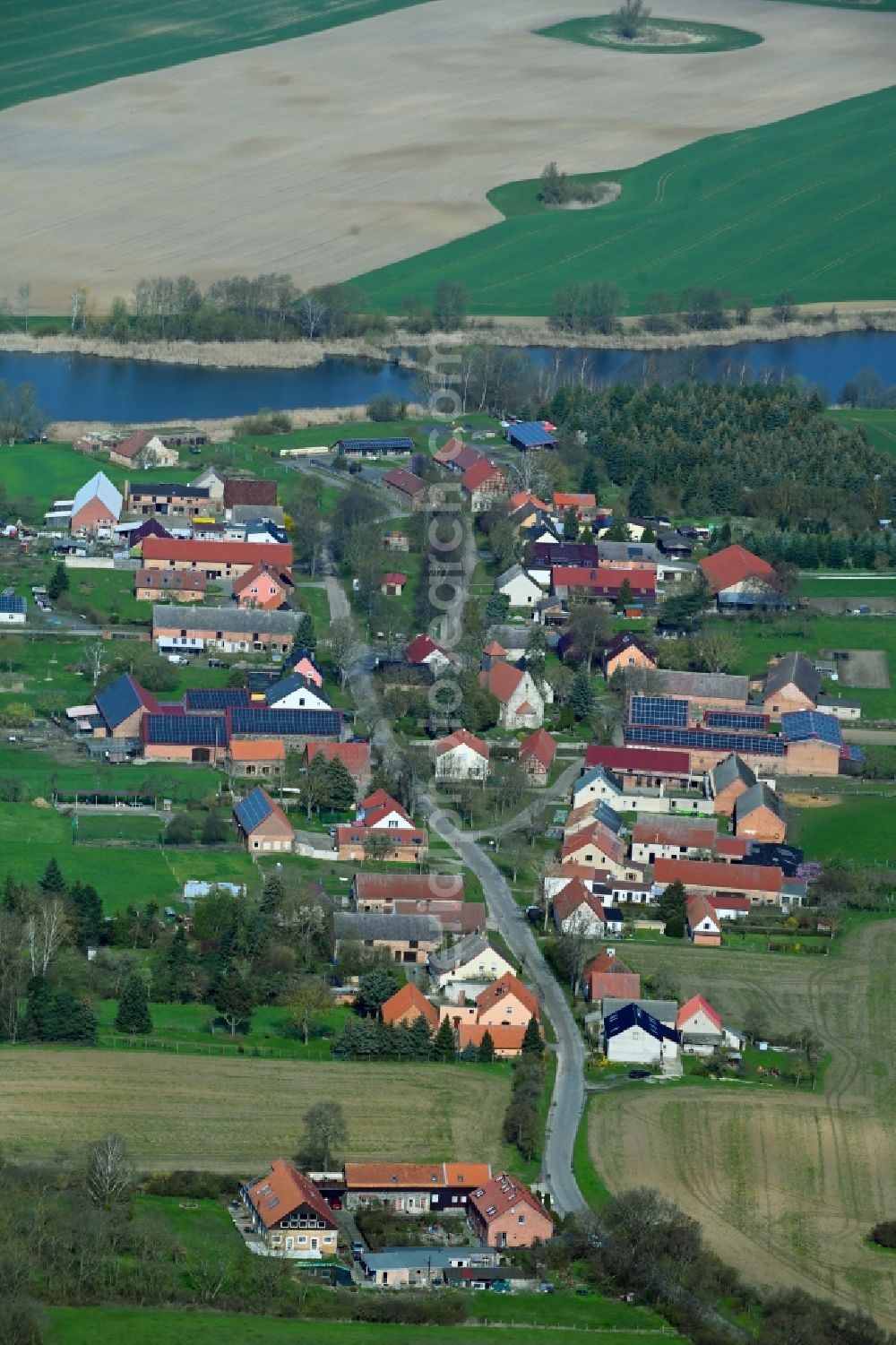 Bölkendorf from the bird's eye view: Village on the lake bank areas of Krummer See in Boelkendorf in the state Brandenburg, Germany