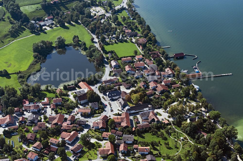 Aerial photograph Chieming - Village on the lake bank areas of Chiemsee with Pfeffersee in Chieming in the state Bavaria, Germany