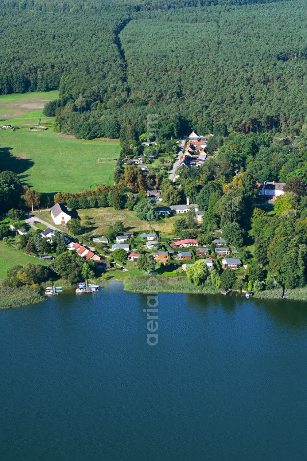 Gühlen from above - Village on the lake bank areas of Gudelacksee in Guehlen at Mark in the state Brandenburg, Germany