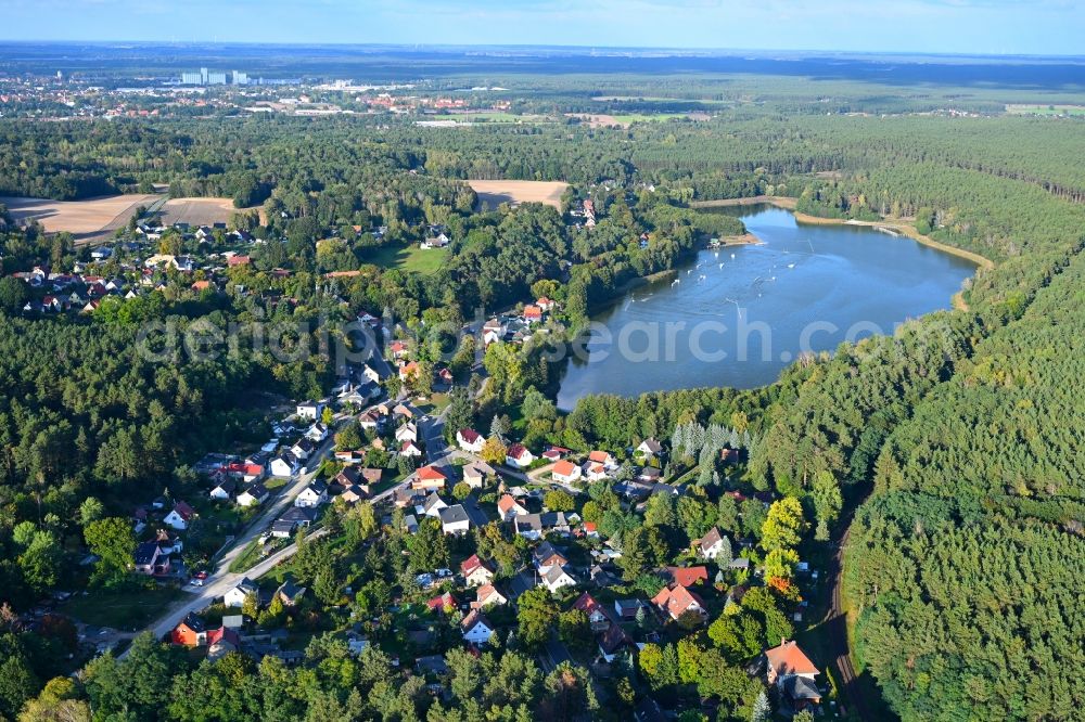 Aerial image Petersdorf - Village on the lake bank areas of Petersdorfer See in Petersdorf in the state Brandenburg, Germany