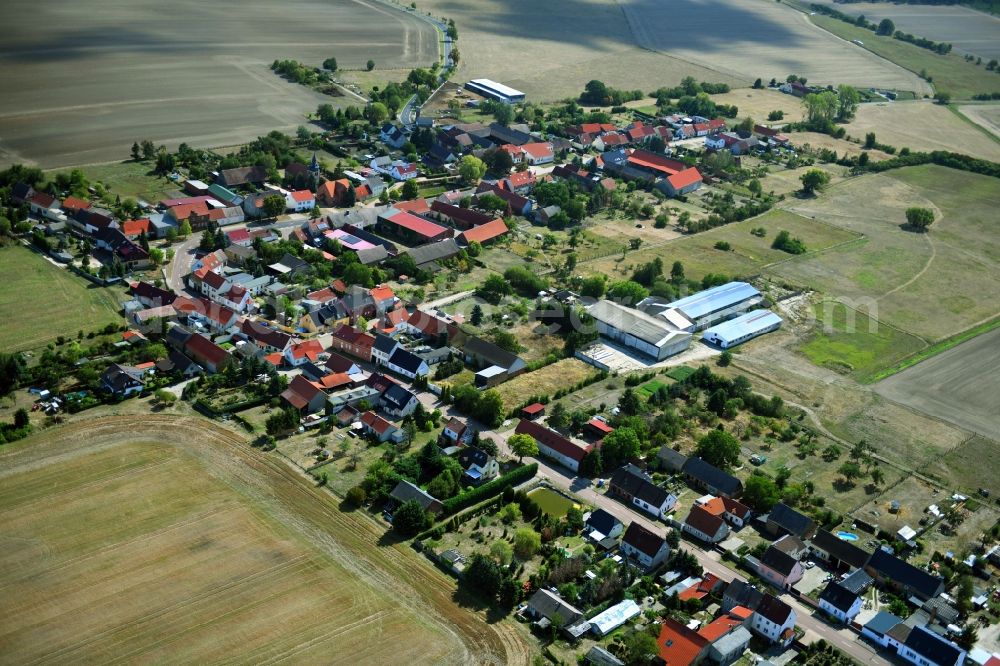 Aerial image Senst - Agricultural land and field borders surround the settlement area of the village in Senst in the state Saxony-Anhalt, Germany