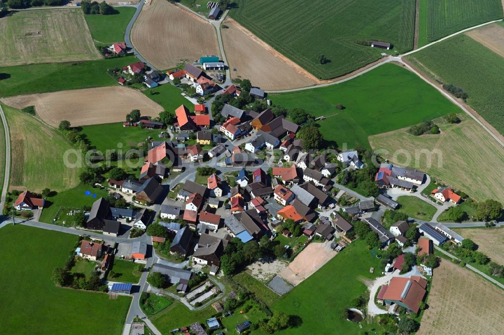 Aerial image Seubersdorf - Agricultural land and field borders surround the settlement area of the village in Seubersdorf in the state Bavaria, Germany