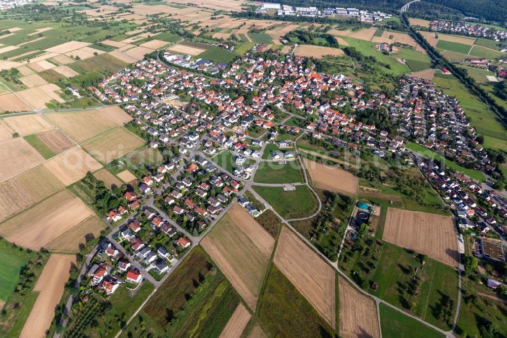 Sickenhausen from above - Agricultural land and field borders surround the settlement area of the village in Sickenhausen in the state Baden-Wuerttemberg, Germany