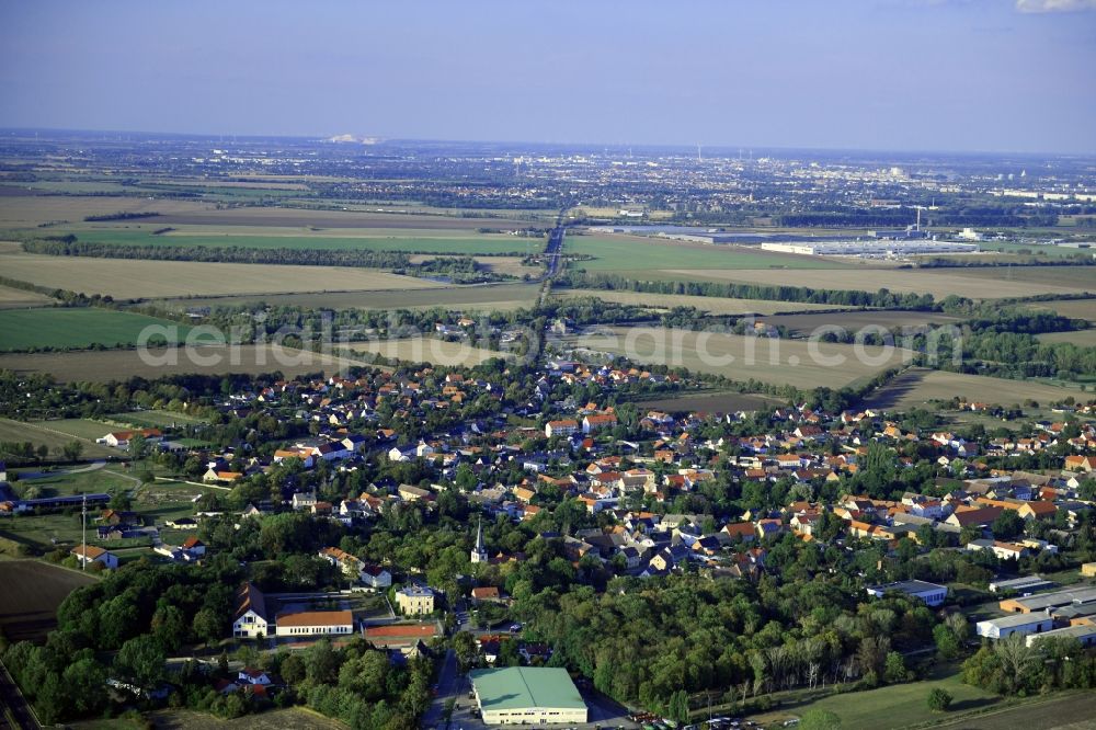 Aerial image Sülzetal - Agricultural land and field borders surround the settlement area of the village in Suelzetal in the state Saxony-Anhalt, Germany