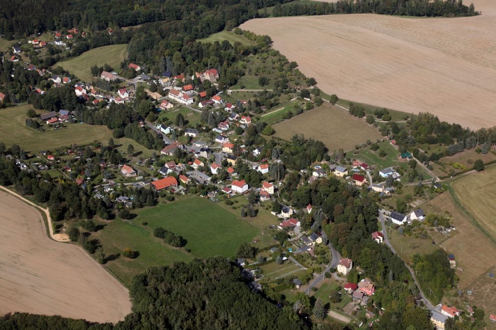 Struppen from above - Agricultural land and field borders surround the settlement area of the village Thuermsdorf in Struppen in the state Saxony, Germany