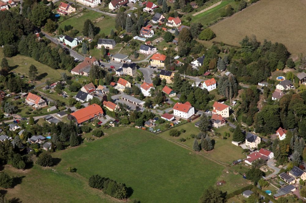 Struppen from the bird's eye view: Agricultural land and field borders surround the settlement area of the village Thuermsdorf in Struppen in the state Saxony, Germany