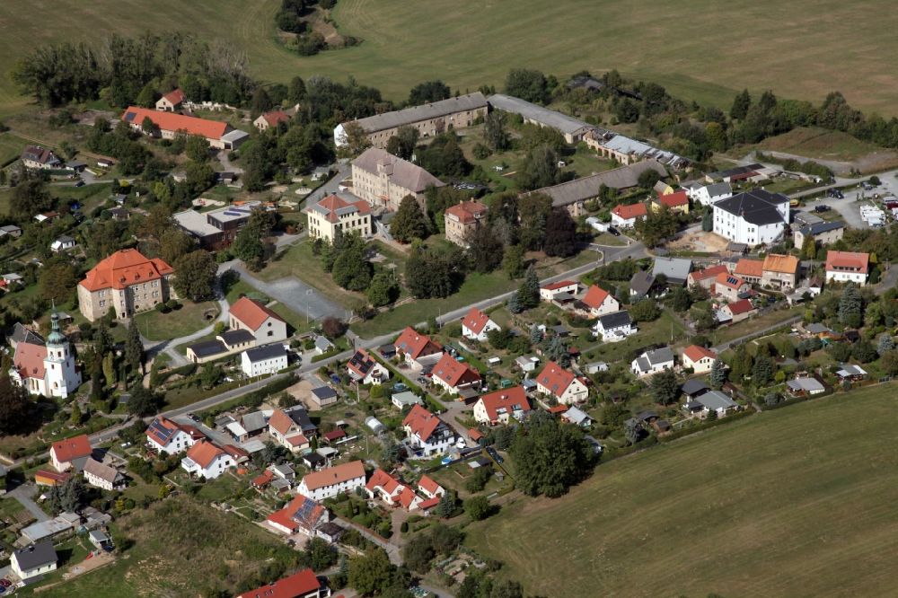Aerial image Struppen - Agricultural land and field borders surround the settlement area of the village in Struppen in the state Saxony, Germany. Struppen Palace to the left of the center of the picture