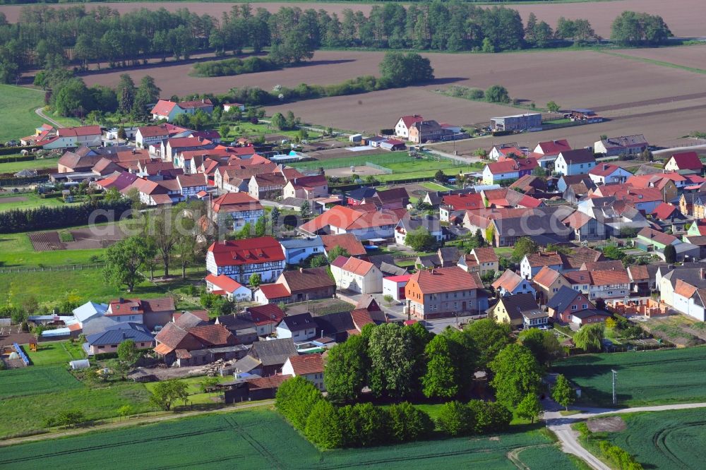 Aerial image Thürungen - Agricultural land and field borders surround the settlement area of the village in Thuerungen in the state Saxony-Anhalt, Germany