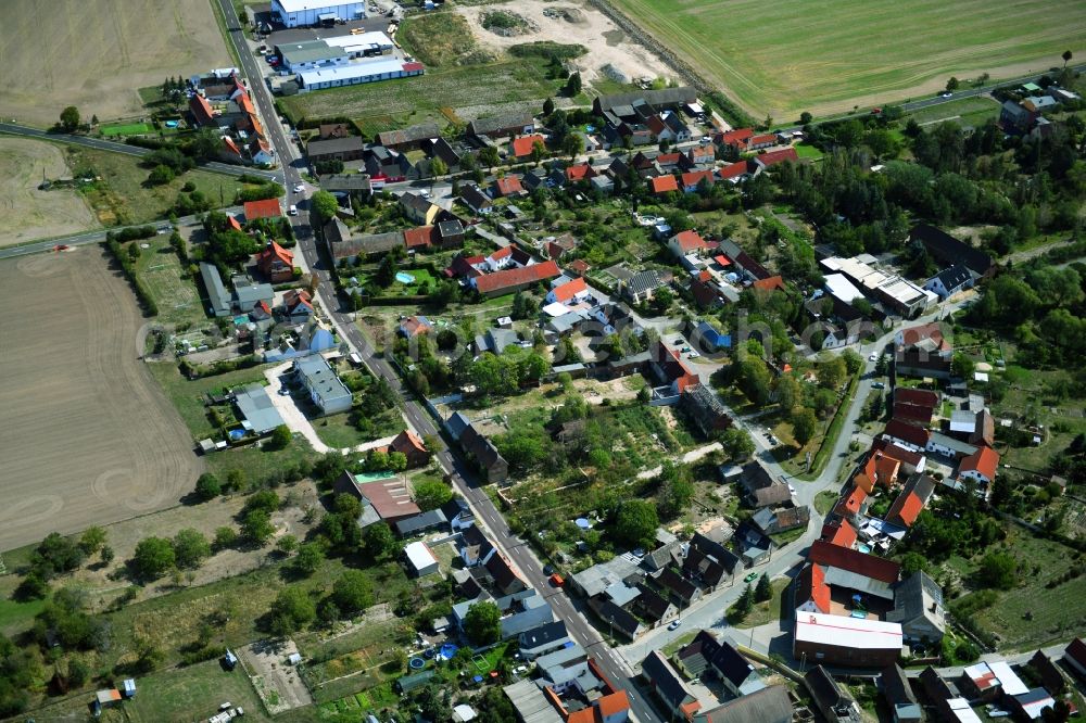 Aerial image Tornau vor der Heide - Agricultural land and field borders surround the settlement area of the village in Tornau vor der Heide in the state Saxony-Anhalt, Germany
