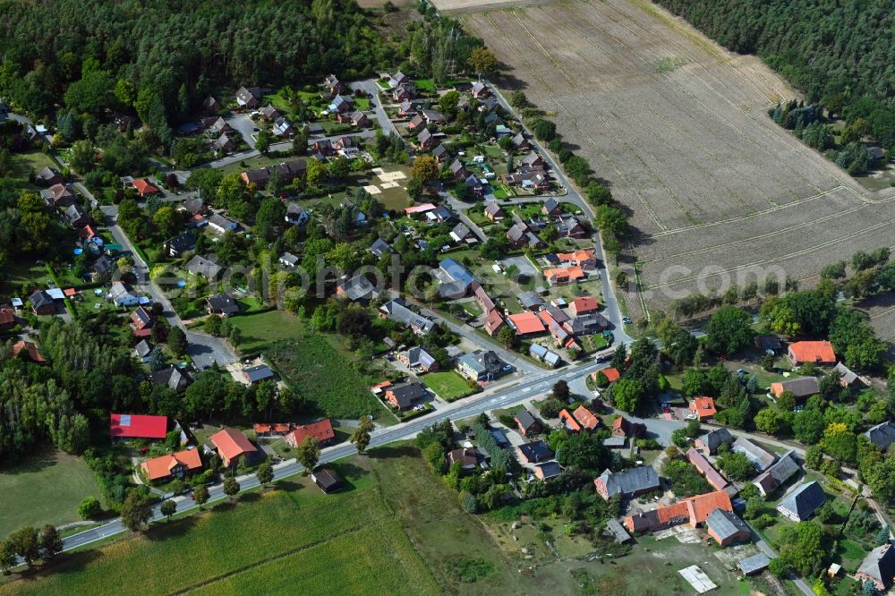 Aerial photograph Tramm - Agricultural land and field borders surround the settlement area of the village in Tramm in the state Lower Saxony, Germany