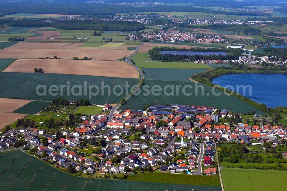 Aerial image Utphe - Agricultural land and field borders surround the settlement area of the village in Utphe in the state Hesse, Germany