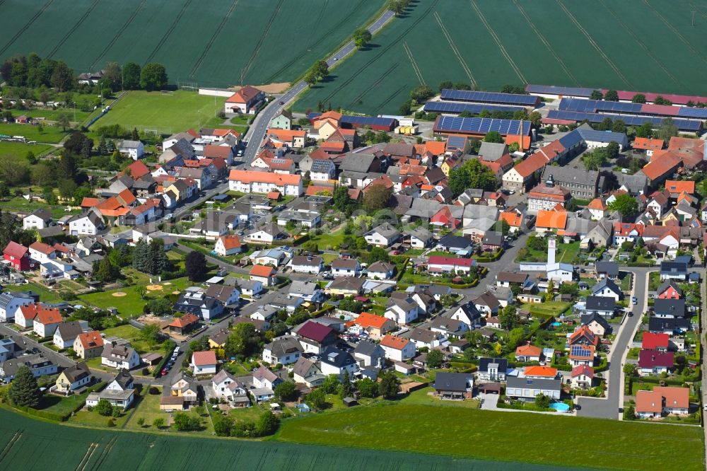 Aerial photograph Utphe - Agricultural land and field borders surround the settlement area of the village in Utphe in the state Hesse, Germany