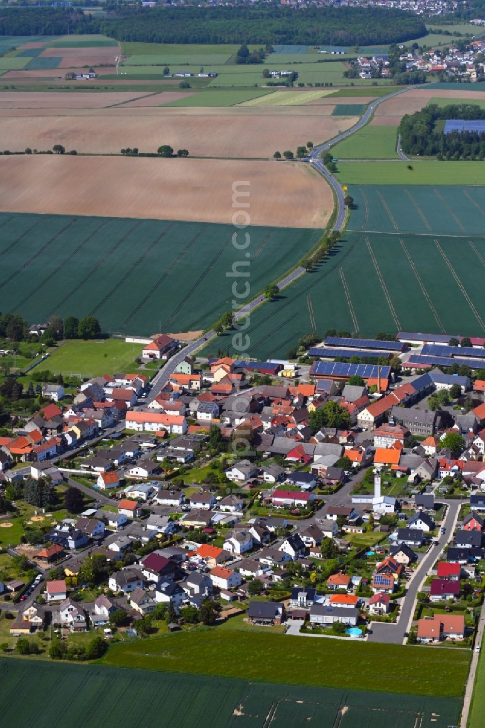 Utphe from the bird's eye view: Agricultural land and field borders surround the settlement area of the village in Utphe in the state Hesse, Germany