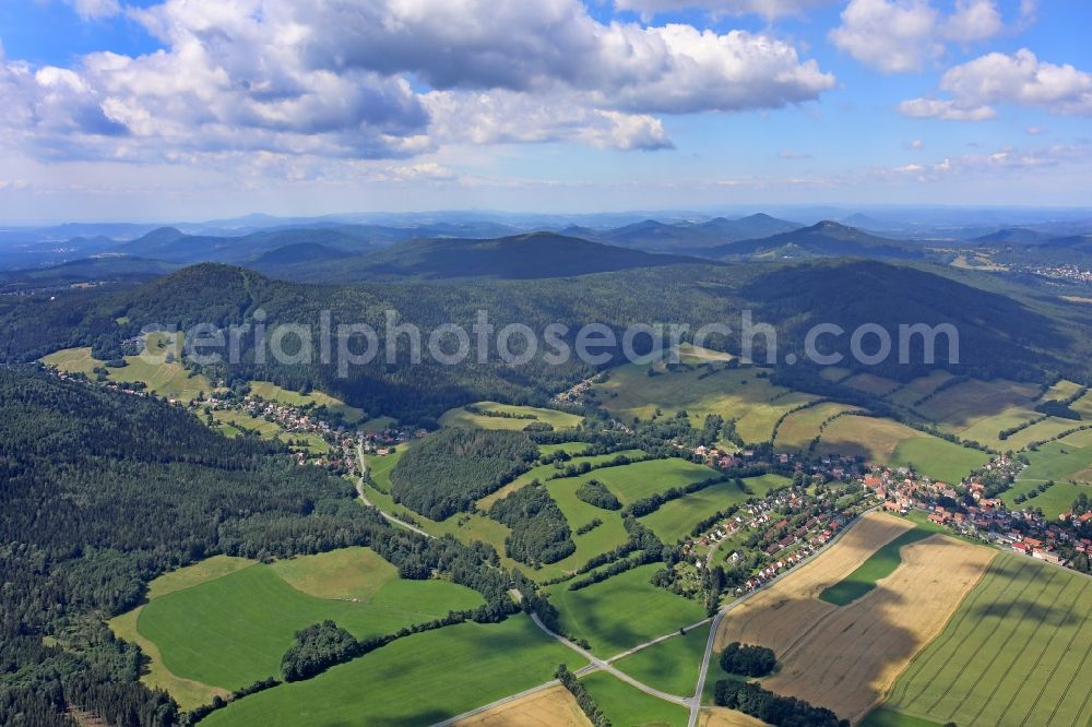Aerial image Waltersdorf - Agricultural land and field borders surround the settlement area of the village in Waltersdorf in the state Saxony, Germany
