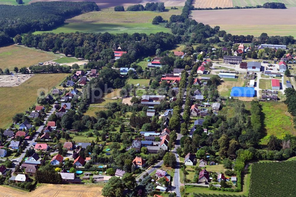 Wesendahl from above - Agricultural land and field borders surround the settlement area of the village in Wesendahl in the state Brandenburg, Germany