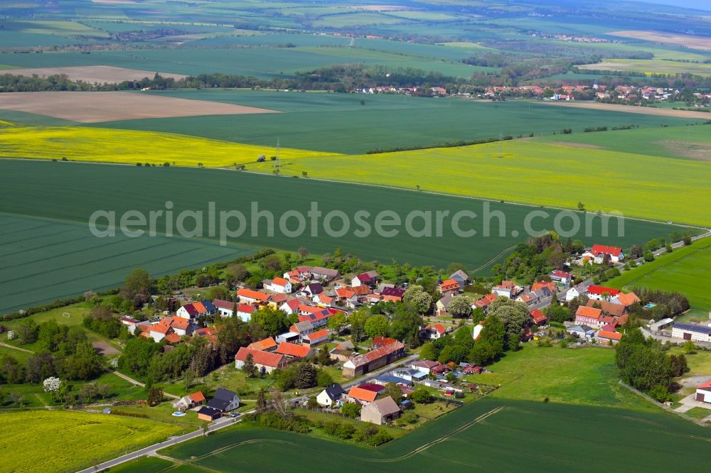 Aerial photograph Wolferschwenda - Agricultural land and field borders surround the settlement area of the village in Wolferschwenda in the state Thuringia, Germany