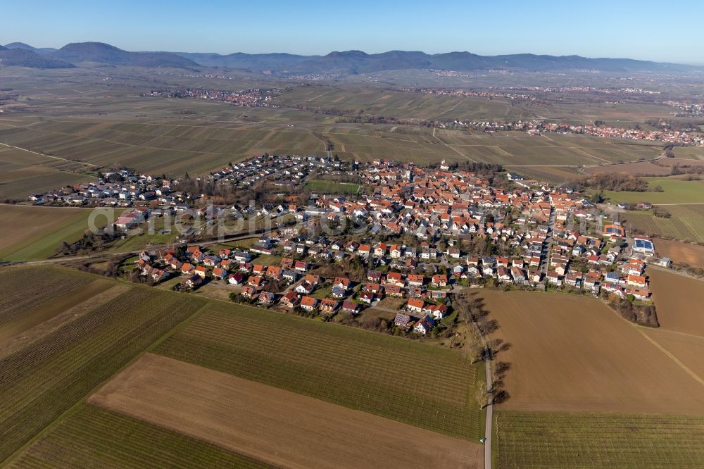 Aerial image Wollmesheim - Agricultural land and field borders surround the settlement area of the village in Wollmesheim in the state Rhineland-Palatinate, Germany