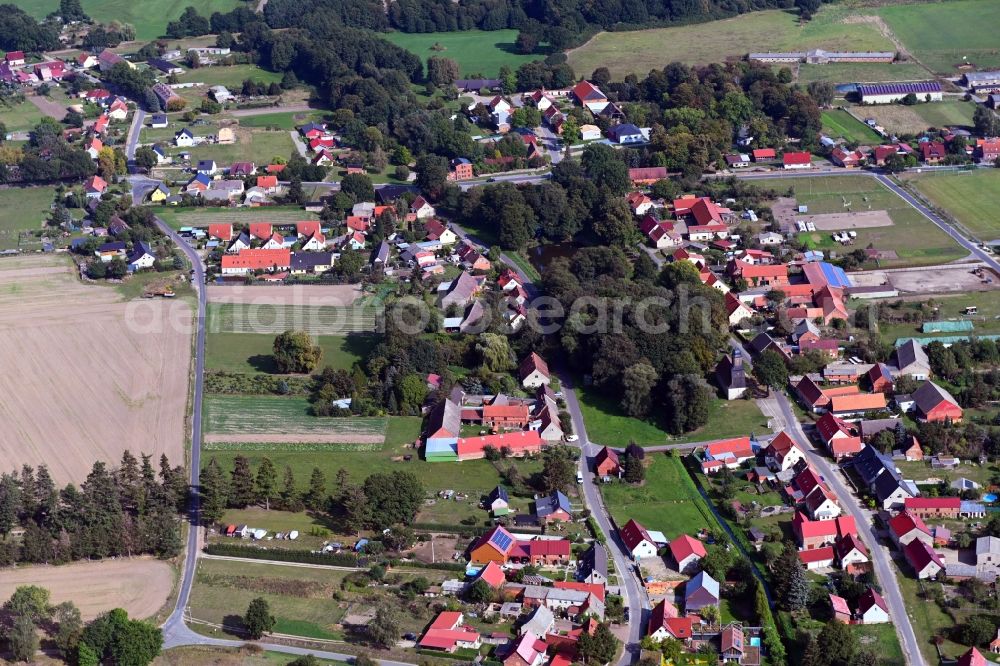 Aerial image Zaatzke - Agricultural land and field borders surround the settlement area of the village in Zaatzke in the state Brandenburg, Germany