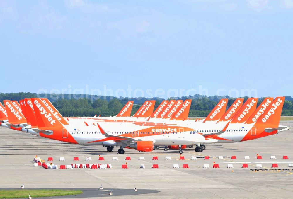 Aerial image Schönefeld - Passenger airplanes of airline easyjet - closed due to crisis - in parking position - parking area at the airport in Schoenefeld in the state Brandenburg, Germany