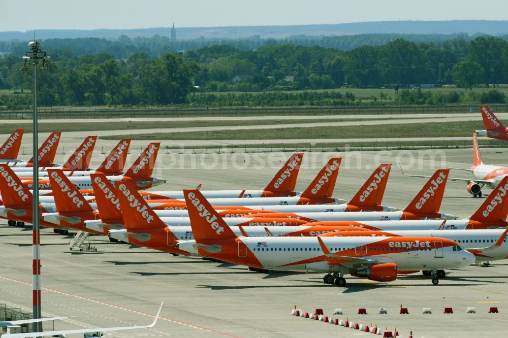 Schönefeld from above - Passenger airplanes of airline easyjet - closed due to crisis - in parking position - parking area at the airport in Schoenefeld in the state Brandenburg, Germany