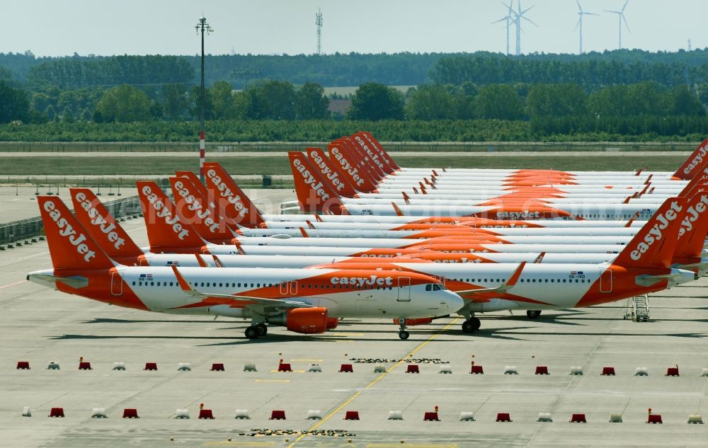 Schönefeld from the bird's eye view: Passenger airplanes of airline easyjet - closed due to crisis - in parking position - parking area at the airport in Schoenefeld in the state Brandenburg, Germany
