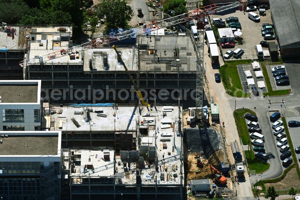 Aerial image Schönefeld - Construction site for the new residential and commercial Corner house - building BB Business Hub on Mittelstrasse corner Kurzer Weg in Schoenefeld in the state Brandenburg, Germany