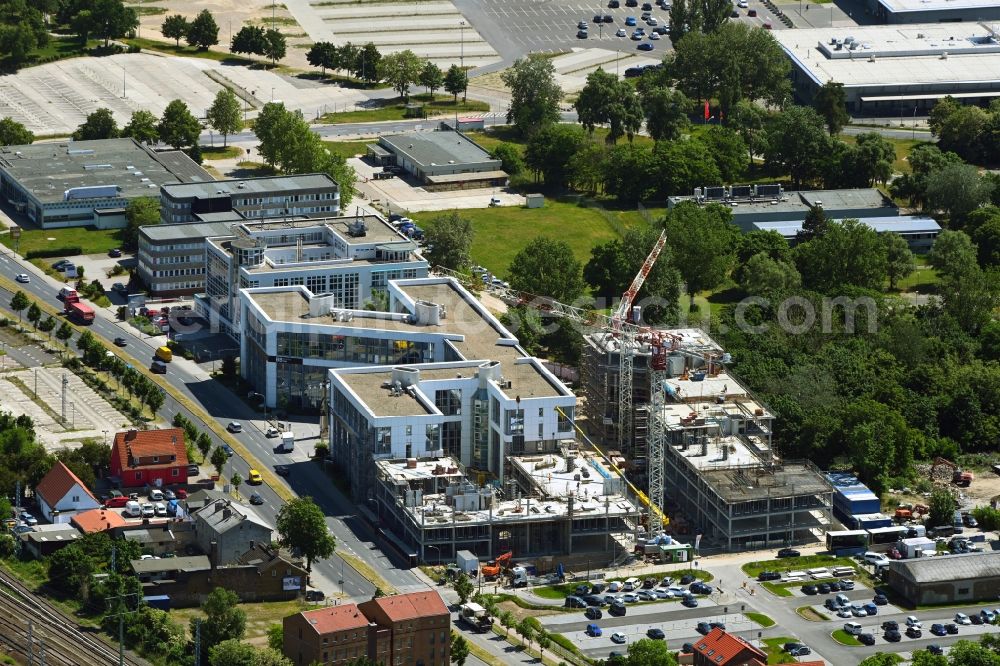 Aerial image Schönefeld - Construction site for the new residential and commercial Corner house - building BB Business Hub on Mittelstrasse corner Kurzer Weg in Schoenefeld in the state Brandenburg, Germany