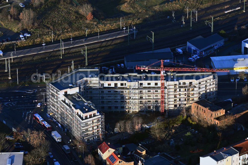 Leipzig from the bird's eye view: Construction site for the new residential and commercial Corner house - building Mockauer Tor on street Mockauer Strasse - Volbedingstrasse in the district Mockau in Leipzig in the state Saxony, Germany