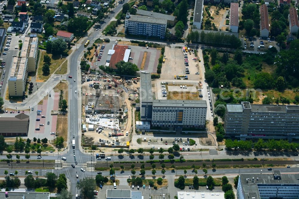 Berlin from above - Construction site for the new residential and commercial Corner house - building on Marzahner Chaussee Ecke Allee of Kosmonauten in the district Marzahn in Berlin, Germany