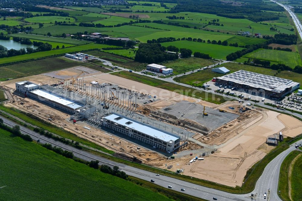 Aerial photograph Neumünster - EDEKA - Construction site for a warehouse and forwarding building with Frischelager on Eichhofpark in Neumuenster in the state Schleswig-Holstein, Germany
