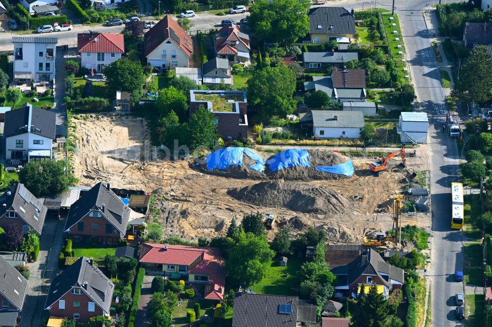 Berlin from above - Construction site for the new construction of a detached house in a family house - settlement along the on street Neuenhagener Strasse in the district Mahlsdorf in Berlin, Germany