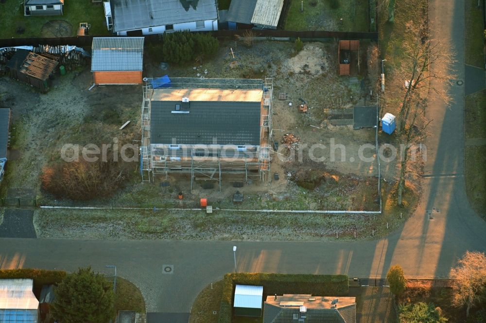 Vogelsdorf from the bird's eye view: Construction site for the new construction of a detached house in a family house - settlement along the Heideweg corner Friedrich-Ebert-Strasse in Vogelsdorf in the state Brandenburg, Germany