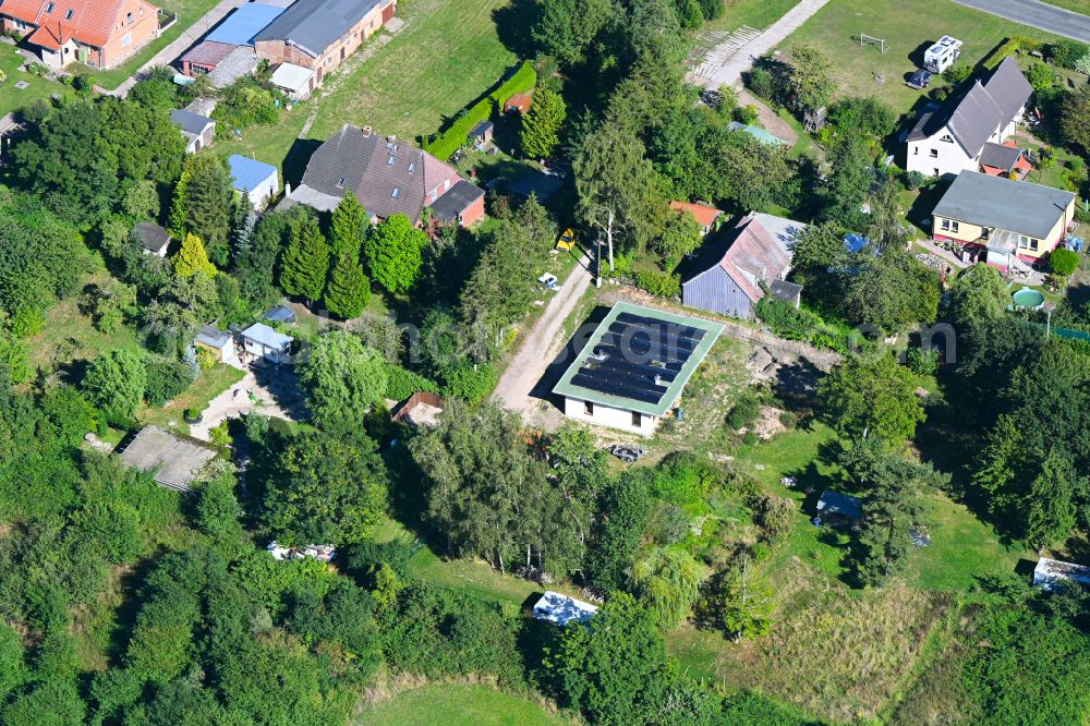 Aerial photograph Kenz - Construction site for the new construction of a detached house in a family house - settlement along the on street Zu den Dorfwiesen in Kenz in the state Mecklenburg - Western Pomerania, Germany
